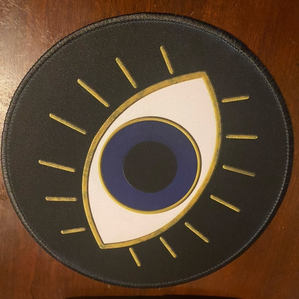 Evil eye mouse pad about eight in - new in package